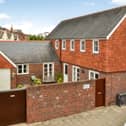 The listing says: "A unique opportunity to acquire a detached Coach House that was built in 1995 to a bespoke architectural design, the L shaped accommodation is arranged over two floors, providing 1403 sq ft of living space over two floors." 