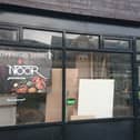 Signage has made an appearance at an empty former Indian restaurant to confirm that a new food venue will be opening soon. 