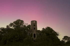 Northern Lights over Racton Ruins in Chichester as Aurora Borealis passes over UK.
