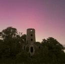 Northern Lights over Racton Ruins in Chichester as Aurora Borealis passes over UK.