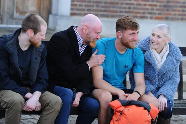 Royal Navy technician Will Matthews has run 16 marathons in 13 days to raise money for his mum's cancer treatment. His journey started in Scotland and ended at Portsmouth Historic Dockyard, where family, friends and colleagues gathered to greet him on October 17, 2024.
Pictured is: Will Matthews with his family (l-r) brother Ryan, dad Shaun and mum Lorna.