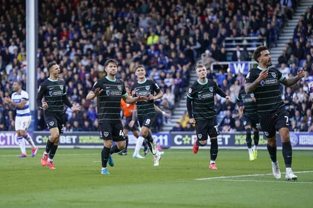 Pompey's players celebrate Callum Lang's match-winning penalty against QPR. Picture: Jason Brown/ProSportsImages