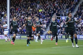 Pompey's players celebrate Callum Lang's match-winning penalty against QPR. Picture: Jason Brown/ProSportsImages