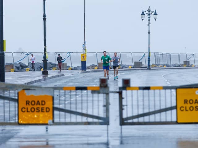 Despite The Great South Run's cancellation many runners took to Southsea in dire weather conditions.