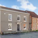 This home comes with three bedrooms, two bathrooms and two reception rooms. 