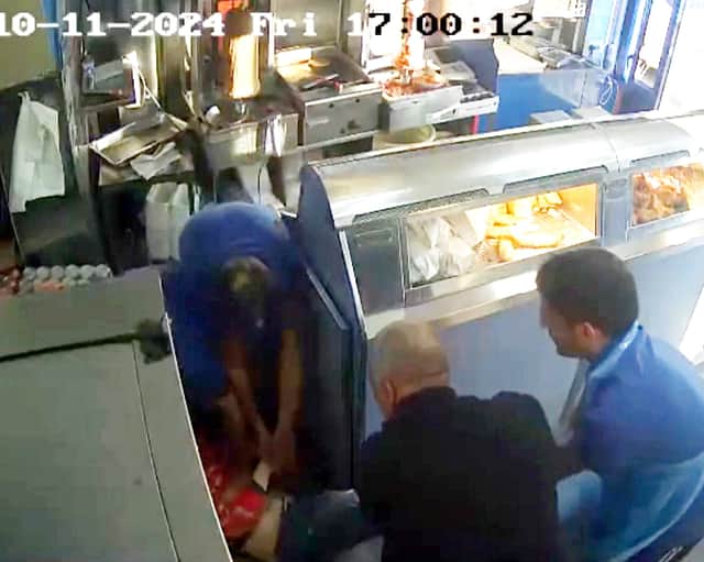Staff at Ben's Fish Bar in Sparkbrook, Birmingham, restrain a knife-wielding robber.
