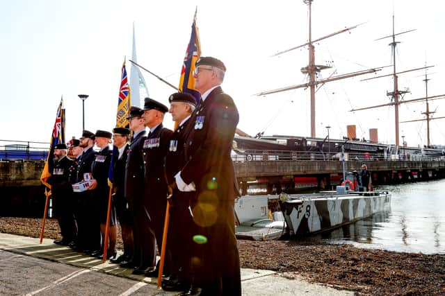 Servicemen and women past and present in front of HMS Warrior and landing craft F8. Poppy Appeal launch at HMNB Portsmouth.