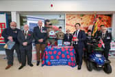 The Havant Poppy Appeal has been launched, with a call for residents to get behind the cause once again. Pictured: Mayor of Havant Cllr Peter Wade, second left, poppy appeal organiser for Havant Andy Carter MBE, third left, Alan Mak MP, fourth from right, Rick Standen who is chair of the Havant branch of the Royal British Legion, right, and others at the launch of the Havant Poppy Appeal at Tesco, Havant
Picture: Chris  Moorhouse (241024-04)