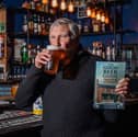 Rob Cocker, from Stoke-on-trent, with his good beer guide in his local pub Manor Court Ale House enjoying a pint of beer to add to his list. So far he has visited over 12,000 pubs in 55 years. Photo: William Lailey / SWNS