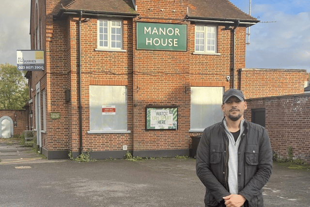 Cllr Gardner outside The Manor House pub in Drayton.