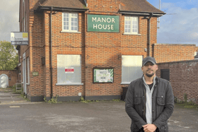 Cllr Gardner outside The Manor House pub in Drayton.
