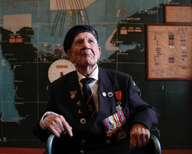 Normandy veteran George Chandler, 99, posing for a photograph in the Map room at Southwick House, the nerve centre of D-Day operations. Mr Chandler has died at the age of 99.