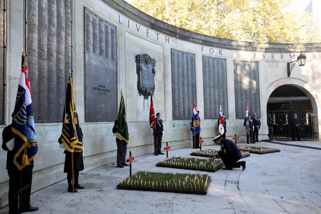 Portsmouth will be honouring the fallen on Remembrance Sunday and Armistice Day. Pictured: Cdre John Voyce, commanding office of HMNB Portsmouth, lays a cross. Armistice Day Service, Cenotaph, Guildhall Square, Portsmouth
