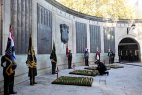 Portsmouth will be honouring the fallen on Remembrance Sunday and Armistice Day. Pictured: Cdre John Voyce, commanding office of HMNB Portsmouth, lays a cross. Armistice Day Service, Cenotaph, Guildhall Square, Portsmouth