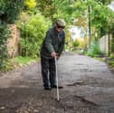 Furious resident Douglas Debnam on Whitebarns Lane in the village of Furneaux Phelham in Hertfordshire, is embroiled in Britain's longest running pothole row.