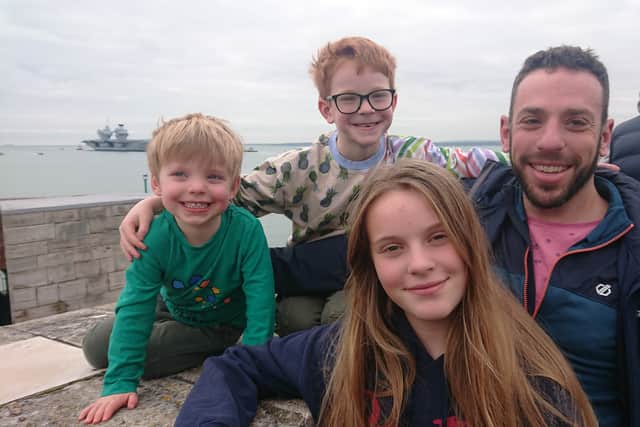 The Weil family waiting for Commander Victoria Percival to return home. From left: Elliot, aged three, Benjamin, aged six, Jess, aged 11, and Daniel, aged 43.