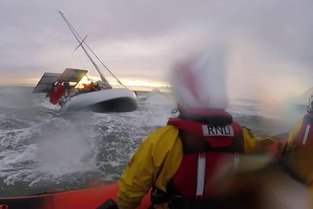 Dramatic footage shows the terrifying moment huge waves crashed into a yacht- seconds before rescue. 