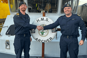 A new commanding officer has taken the helm of the Royal Navy patrol boat HMS Archer. From left: former CO Lt Jack Patterson and new CO Lt Giles Gray.