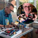 Mark Taylor, a retired art teacher, paints music-themed portraits and album sleeves onto old tin lids and leaves them for gig-goers to take at Waterloo Music Bar.