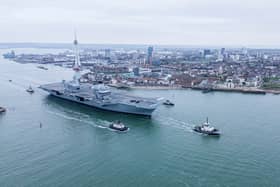HMS Queen Elizabeth leaving Portsmouth on November 4, 2024, for sea trials. Families gathered along The Hot Walls to watch her depart.