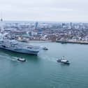 HMS Queen Elizabeth leaving Portsmouth on November 4, 2024, for sea trials. Families gathered along The Hot Walls to watch her depart.