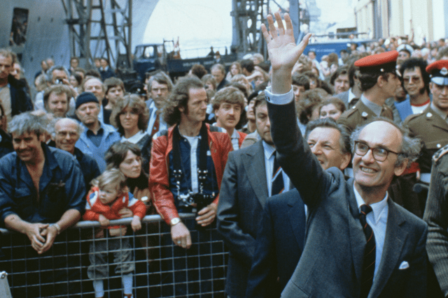 John Nott, the Conservative politician who served as the defence secretary during The Falklands War, has died aged 92. Pictured is him waving to departing servicemen as the liner QE2 leaves Southampton carrying 3000 British troops to South Georgia during the Falklands War, 12th May 1982