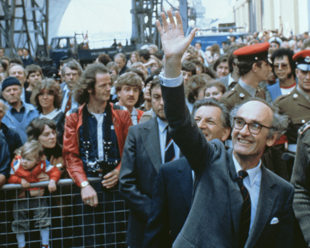 John Nott, the Conservative politician who served as the defence secretary during The Falklands War, has died aged 92. Pictured is him waving to departing servicemen as the liner QE2 leaves Southampton carrying 3000 British troops to South Georgia during the Falklands War, 12th May 1982