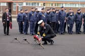The commanding officer of HMS Sultan, captain Mark Hamilton lays a wreath at the Drumhead Ceremony.