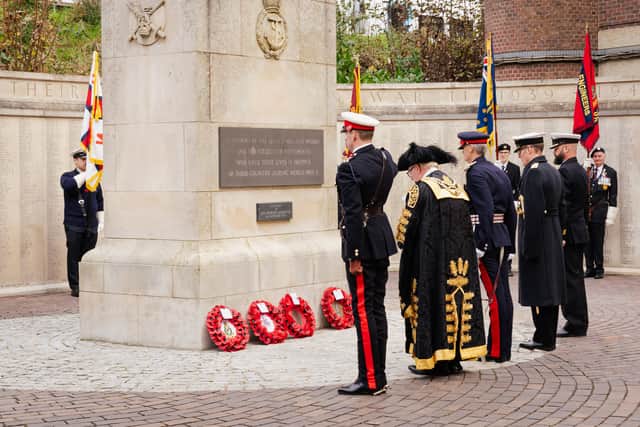 Pictured is: Wreaths are laid at the memorial wall for the civilian casualties of Portsmouth from WWII.