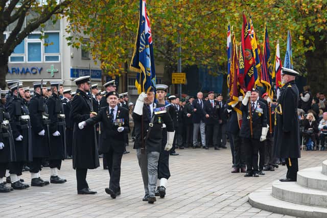 Pictured is: The colours are marched on during the Guildhall Square parade.