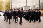 Pictured is: Veterans march off to  cheers and applause as they march past Midshipman from BRNC Dartmouth