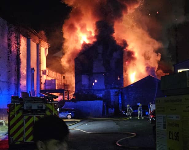 Firefighters tackling a huge fire at the former Dog Inn on Church Street, Preston
