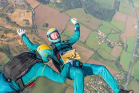 Parachuters performed mid-air manoeuvres which saw the bright turquoise liquid shaken and stirred from heights up to 10,000ft