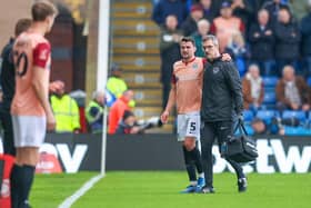 Pompey head of medical. Steve Hard, pictured here with Regan Poole has been credited with bringing in the cardiac screening which spotted a potential risk for striker Colby Bishop leading to the striker undergoing open-heart surgery. 