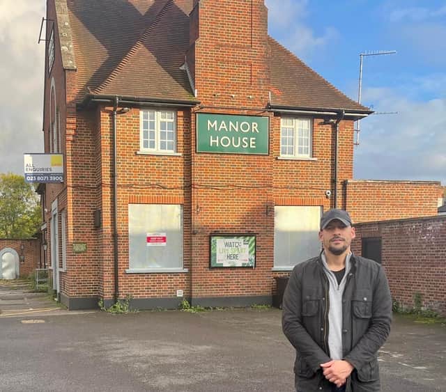 Cllr Gardner outside The Manor House pub in Drayton