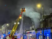 London Fire Brigade tackle a fire at a takeaway in Holloway. 
