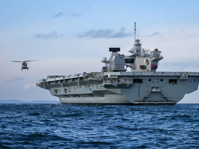 HMS Queen Elizabeth will return to Portsmouth this evening following a diplomatic visit to Germany and a recent run-in with a drone. 
Pictured: HMS Queen Elizabeth conducted some flying training as well as boat drills on November 26.