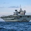 HMS Queen Elizabeth is due to leave Portsmouth Naval base after a previous sailing was postponed.
Pictured: HMS Queen Elizabeth conducted some flying training as well as boat drills on November 26.