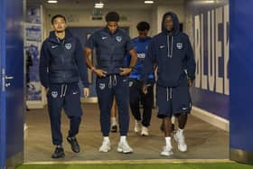 Kusini Yengi, centre, alongside Pompey team-mates Andre Dozzell and Abdoulaye Kamara