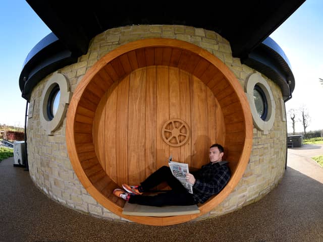 AirB&B host Mike Afflick reads his Lancashire Post while taking a break at his Hobbit House in Inglewhite, near Preston. 
