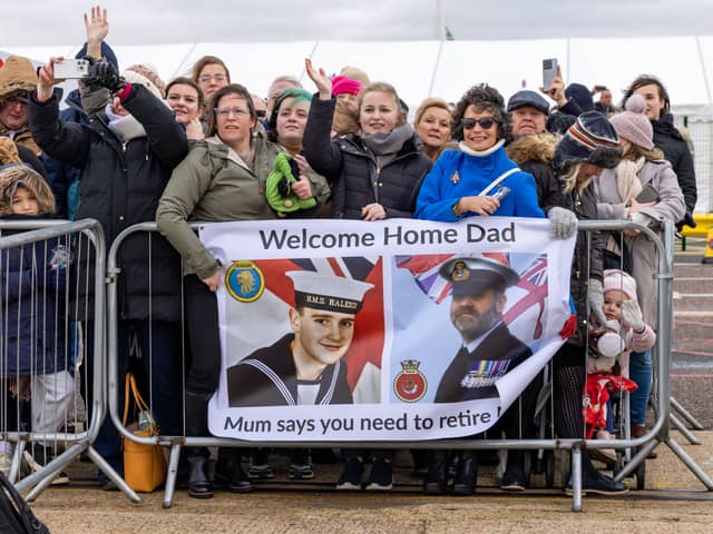 Family and friends gathered to welcome loved ones home to Portsmouth, who had been serving on HMS Duncan for over six months. The Royal Navy Type 45 Destroyer returned back to the naval base for Christmas. Pictured - family waiting for Warrant Officer Daz Hemmings (54) at HMNB Portsmouth.