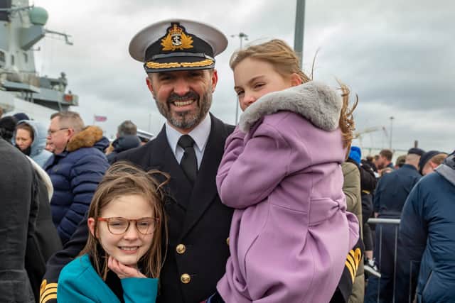 Commanding Officer Commander Daniel Lee (40) with daughters Jemima (9) and Abigail (8).