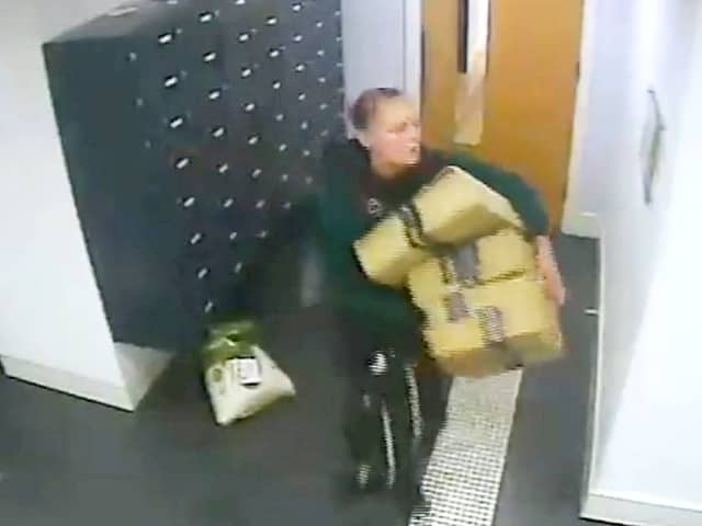 This is the moment a bold thief walks into a luxury apartment block and steals residents Amazon parcels.  