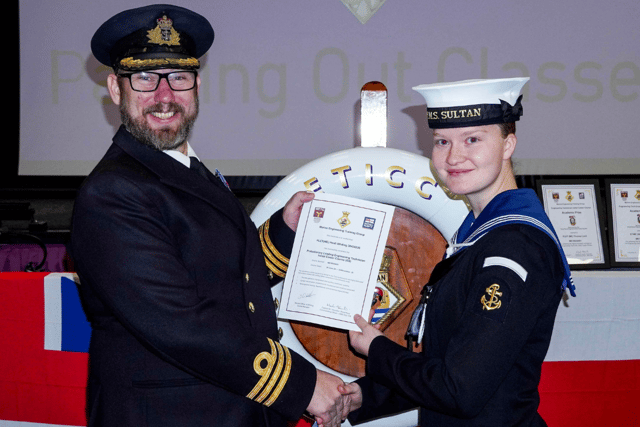 PLET(ME) Heidi Whiting receiving her Phase 2 certificate from Cdr Marine Engineering, Cdr Will King.
