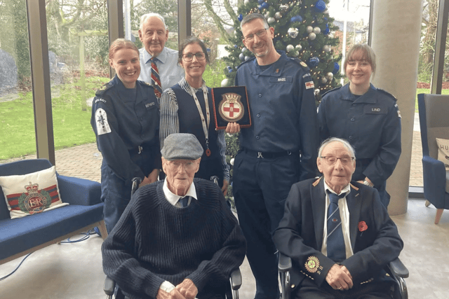 HMS Prince of Wales' ship's company presented a plaque to the care home to mark their visit.