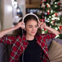 Woman listening to Christmas music.