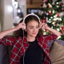 Woman listening to Christmas music.