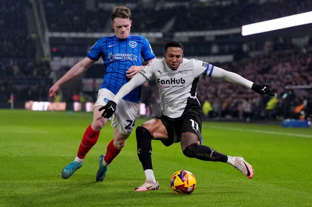 Terry Devlin battles with Nathaniel Mendez-Laing in Pompey's 4-0 defeat at Derby. Picture: Bradley Collyer/PA Wire.