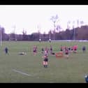 Video grab shows the moment a deer invaded a rugby pitch - and tackled a player. 