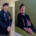 The exhibition, The Lucky Ones Grow Old, features portraits of veterans by Matt Sills taken at The D-Day Story on Wednesday 18th December 2024. Pictured: Cyril Stanley (Stan) Ford alongside his portrait. Picture: Habibur Rahman.